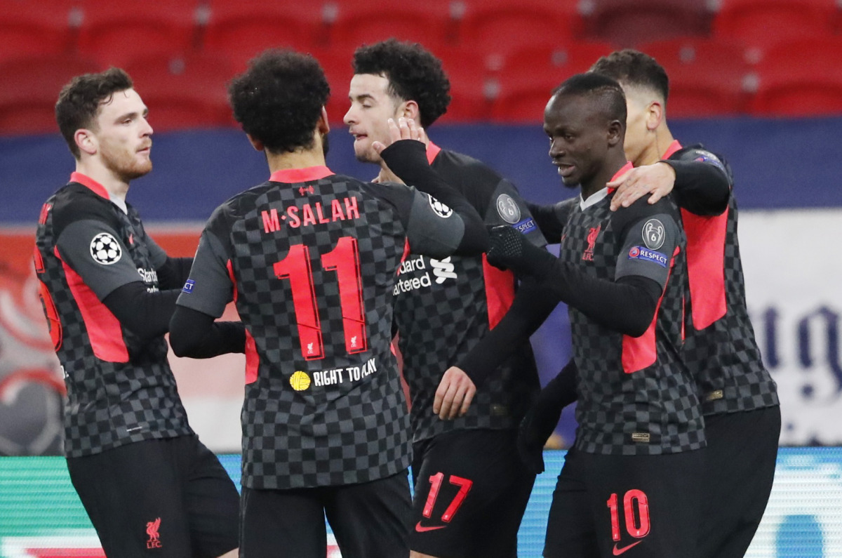 Soccer Football - Champions League - Round of 16 First Leg - RB Leipzig v Liverpool - Puskas Arena, Budapest, Hungary - February 16, 2021 Liverpool's Sadio Mane celebrates scoring their second goal with teammates REUTERS/Bernadett Szabo
