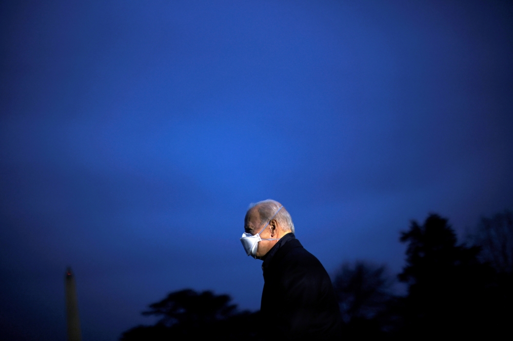 U.S. President Joe Biden leaves the Oval Office as he departs to Camp David from the South Lawn of the White House in Washington, U.S., February 12, 2021.REUTERS/Carlos Barria