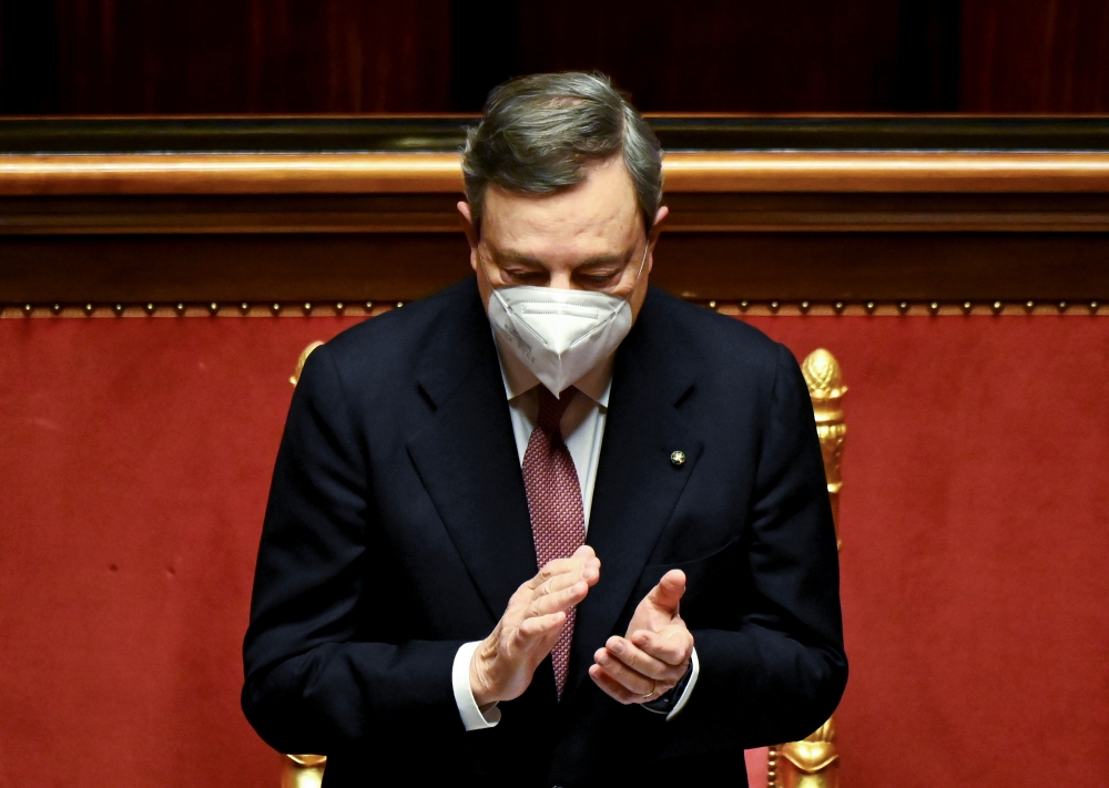 Newly installed Italian Prime Minister Mario Draghi applauds following the speech of the Senate speaker, before addressing the Senate and submitting his government to a vote of confidence, in Rome, Italy, February 17, 2021. Alberto Pizzoli/Pool via Reuter