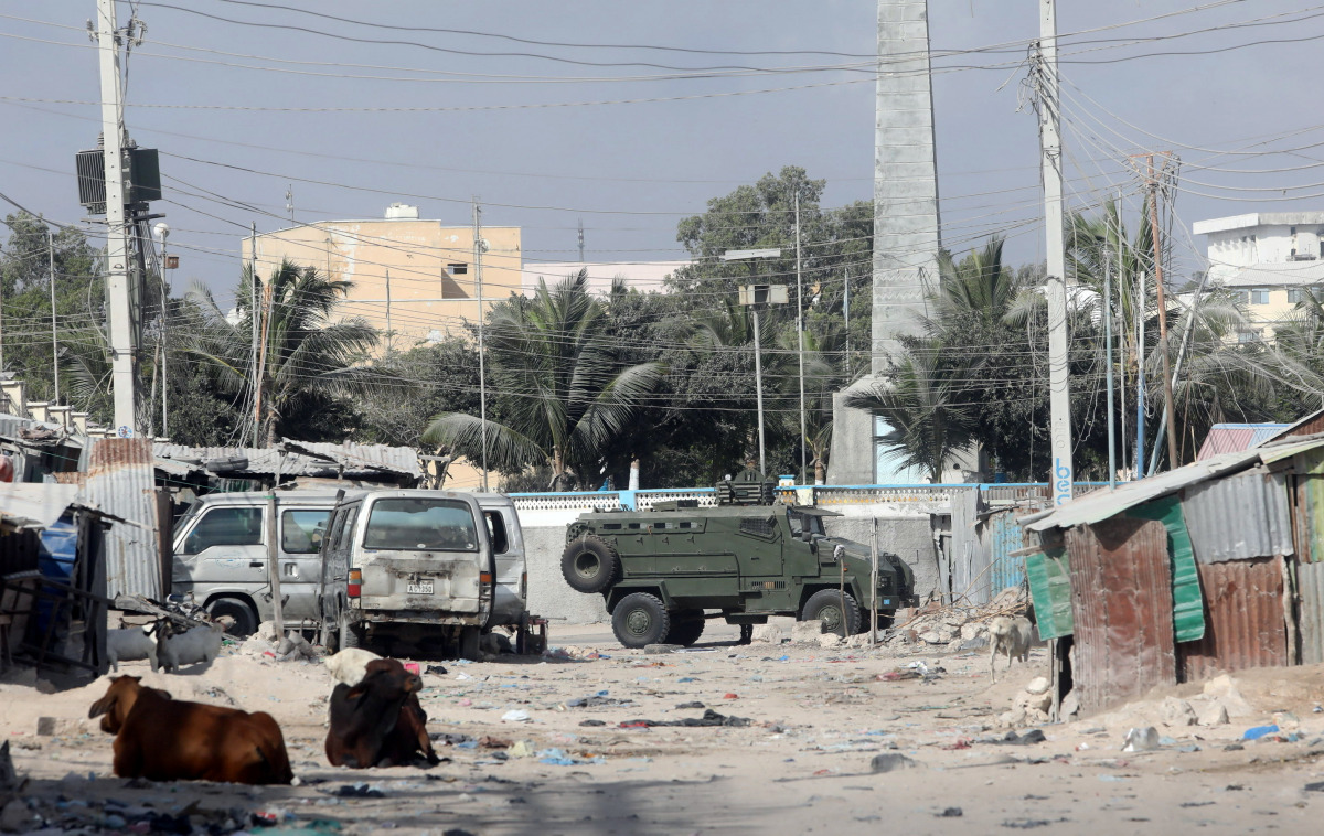 An armoured personnel carrier (APC) drives on a sealed off street to prevent a protest over delayed elections in Mogadishu, Somalia February 19, 2021. REUTERS/Feisal Omar
