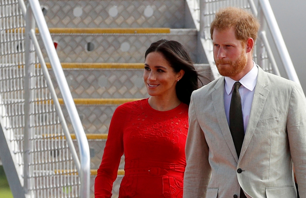 Britain's Prince Harry and Meghan, Duchess of Sussex, arrive at Fua'amotu airport on the main island Tongatapu in Tonga October 25, 2018. REUTERS/Phil Noble/File Photo