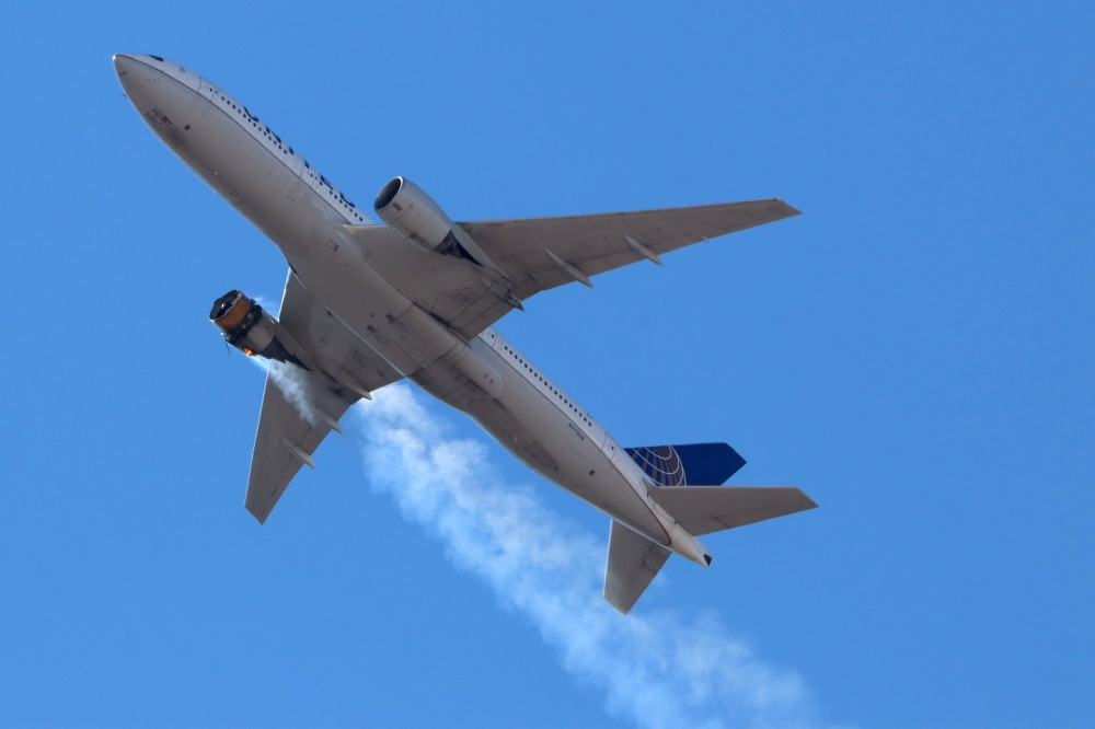 United Airlines flight UA328 returns to Denver International Airport with its starboard engine on fire after it called a Mayday alert, over Denver, Colorado, US February 20, 2021. Hayden Smith/@speedbird5280/Handout via REUTERS