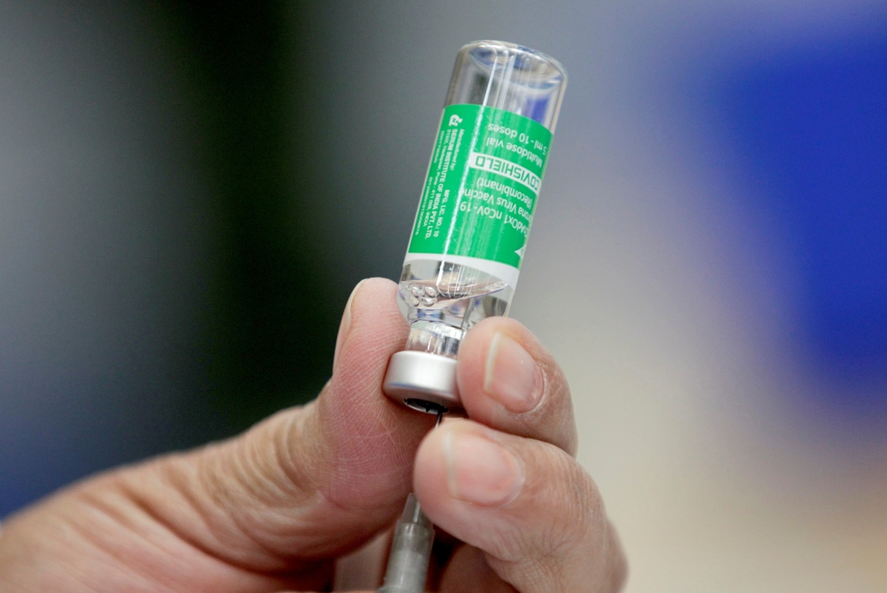 Medical worker prepares a dose of AstraZeneca 