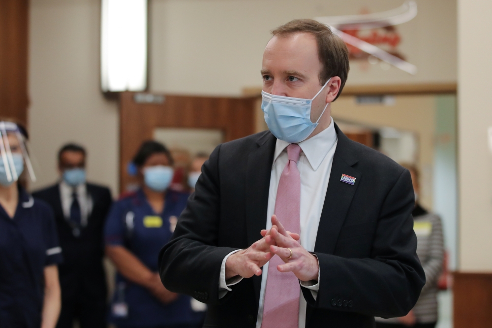 Health Secretary Matt Hancock visits Queen Elizabeth Hospital, amid the spread of the coronavirus disease (COVID-19), in Birmingham, Britain, February 17, 2021. REUTERS/Molly Darlington/Pool