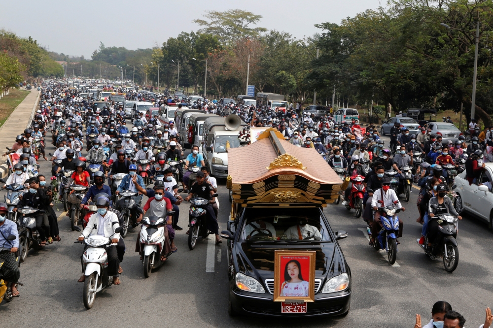 People attend the funeral of Mya Thwate Thwate Khaing, a young woman protester who became the first death among anti-coup demonstrators after she was shot in the head when police tried to disperse a crowd during a protest, in Naypyitaw, Myanmar February 2