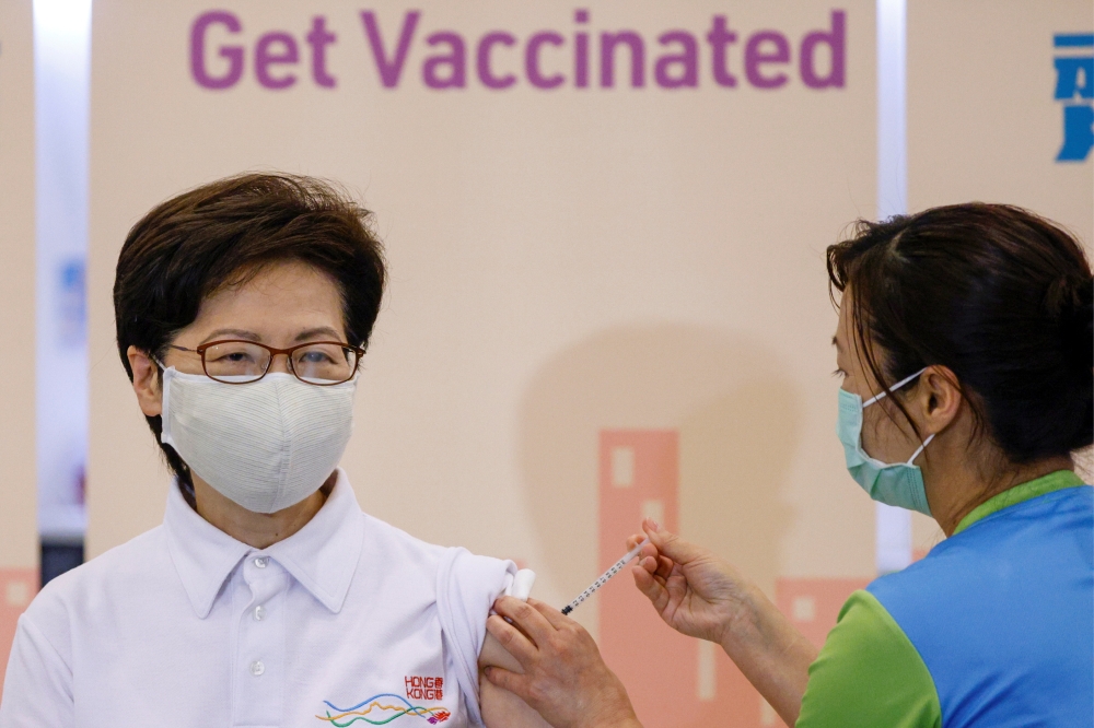 Hong Kong's Chief Executive Carrie Lam receives a dose of the Sinovac Biotech coronavirus disease (COVID-19) vaccine at a community vaccination centre in Hong Kong, China February 22, 2021. REUTERS/Tyrone Siu