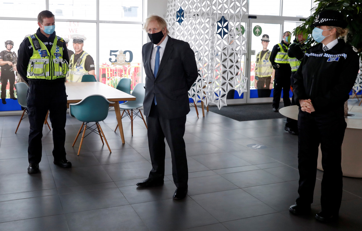 Britain's Prime Minister Boris Johnson visits South Wales Police Headquarters in Bridgend, South Wales, Britain February 17, 2021. Alastair Grant/Pool via REUTERS
