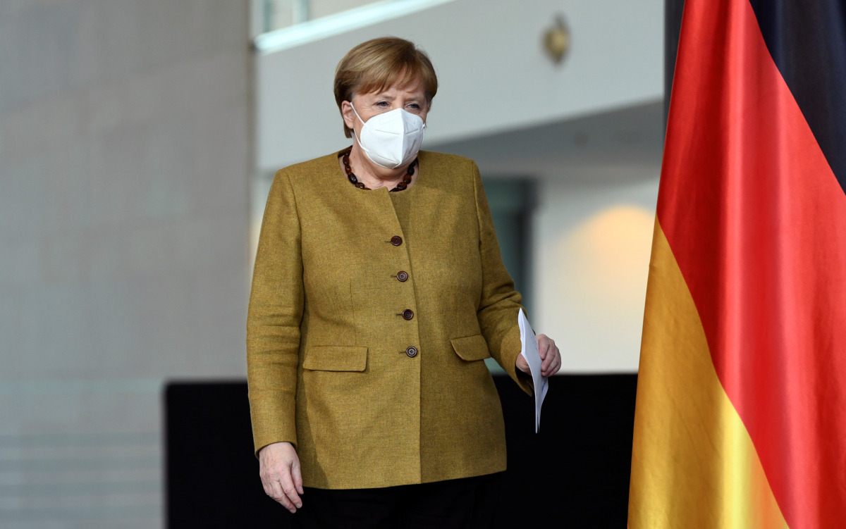 German Chancellor Angela Merkel walks to hold a news conference following a virtual summit with G7 leaders at the Chancellery in Berlin, Germany, February 19, 2021. REUTERS/Annegret Hilse/Pool
