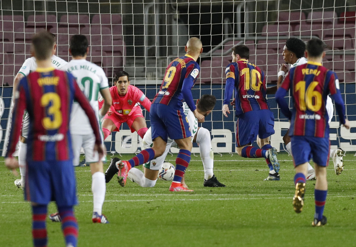 Soccer Football - La Liga Santander - FC Barcelona v Elche - Camp Nou, Barcelona, Spain - February 24, 2021 Barcelona's Lionel Messi scores their first goal REUTERS/Albert Gea
