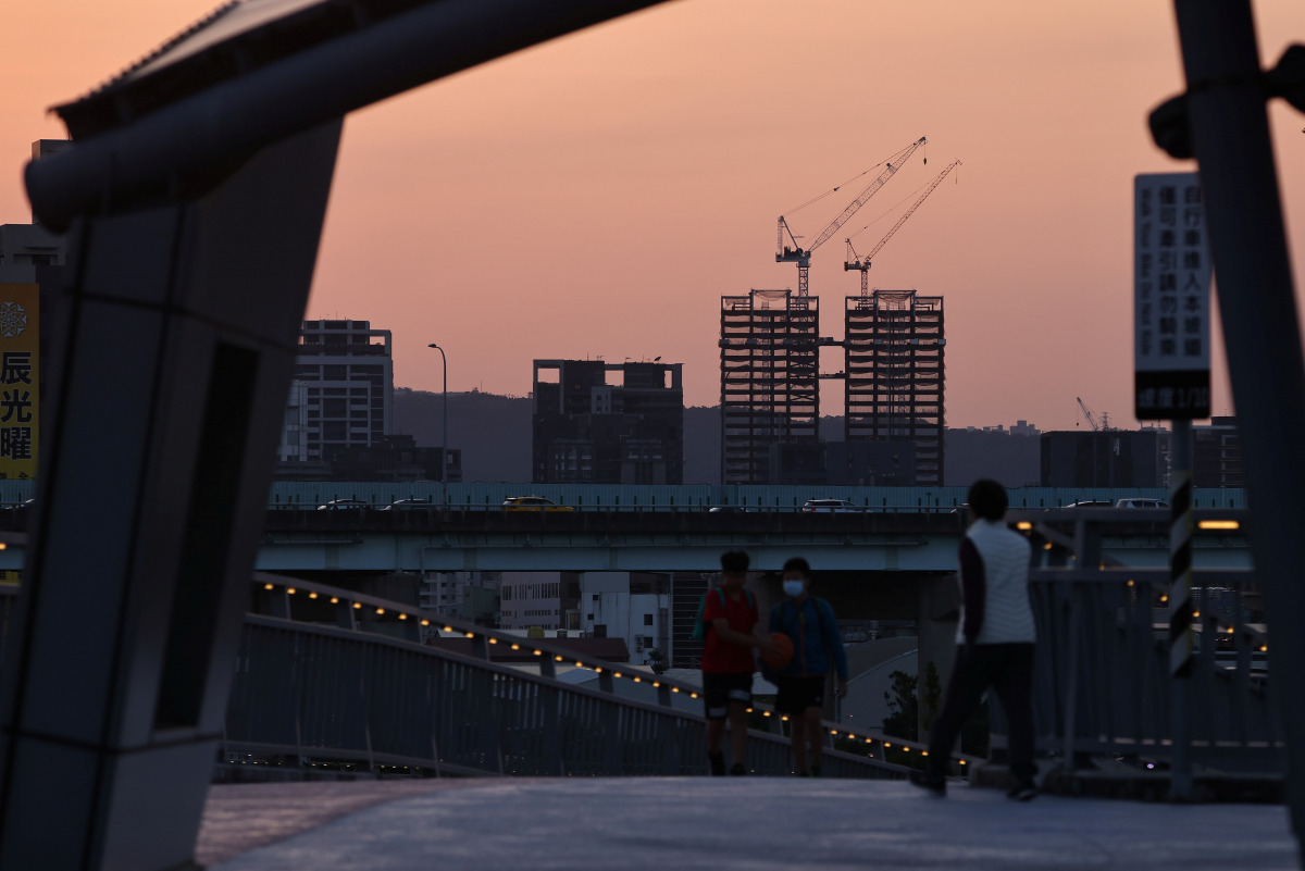 A construction site is seen at sunset hours in Taipei, Taiwan, February 19, 2021. REUTERS/Ann Wang
