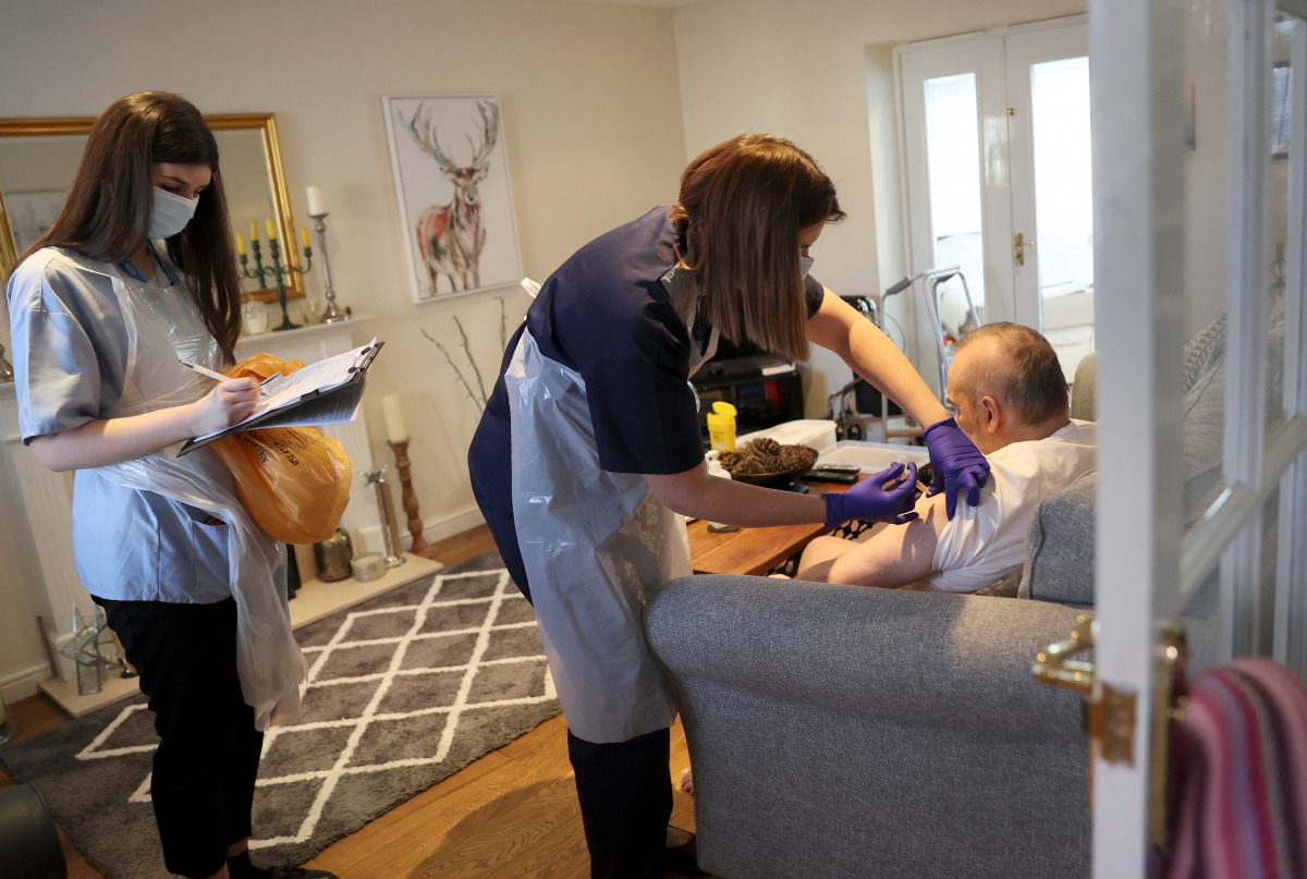 Nurse Elspeth Huber from Hannage Brook Medical Centre administers the COVID 19 vaccine during home visits to the most venerable people amid the outbreak of the coronavirus disease (COVID-19) near Wirksworth, Derbyshire Britain, February 26, 2021. REUTERS/