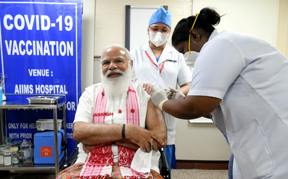 India's Prime Minister Narendra Modi receives a dose of COVAXIN, a coronavirus disease (COVID-19) vaccine developed by India's Bharat Biotech and the state-run Indian Council of Medical Research, at All India Institute of Medical Sciences (AIIMS) hospital