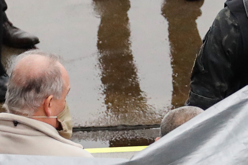 A man, believed to be U.S. citizen Michael Taylor, suspected of helping former Nissan Motor Chairman Carlos Ghosn to escape to Lebanon, is escorted by Japanese officers upon his arrival at Narita airport, following Taylors' extradition to Japanese prosecu
