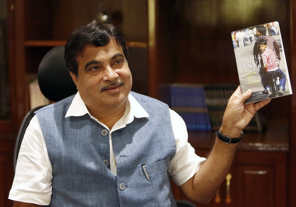 File photo: India's Transport and Shipping Minister Nitin Gadkari displays a book written by him at his office in New Delhi, India August 26, 2015. REUTERS/Anindito Mukherjee/File Photo
