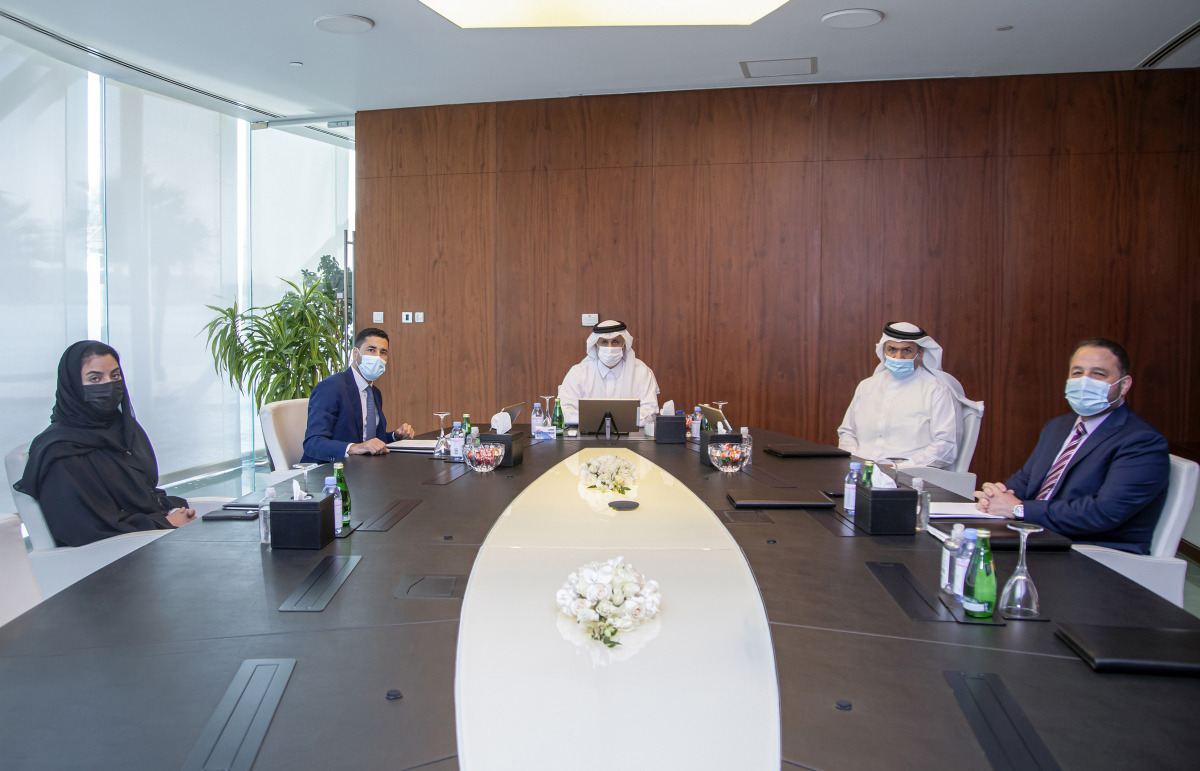 Turki bin Mohammed Al Khater, Ibrahim Jassim Al Othman, and other officials of UDC during the Ordinary General Assembly meeting.