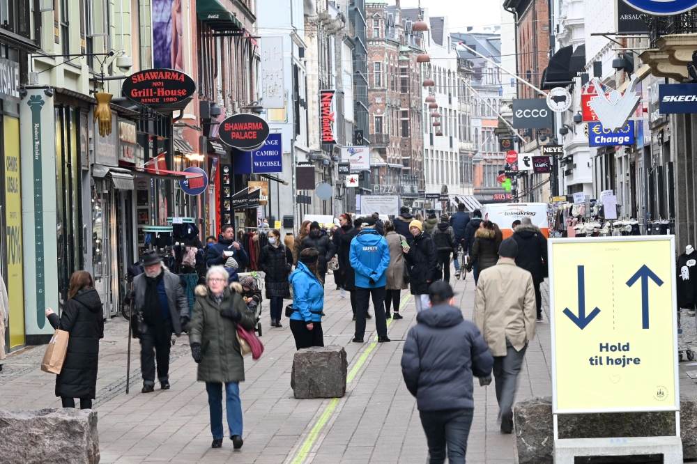 People walk on a street as stores reopen amid the coronavirus disease (COVID-19) pandemic in Copenhagen, Denmark March 1, 2021. Ritzau Scanpix/Philip Davali via Reuters 