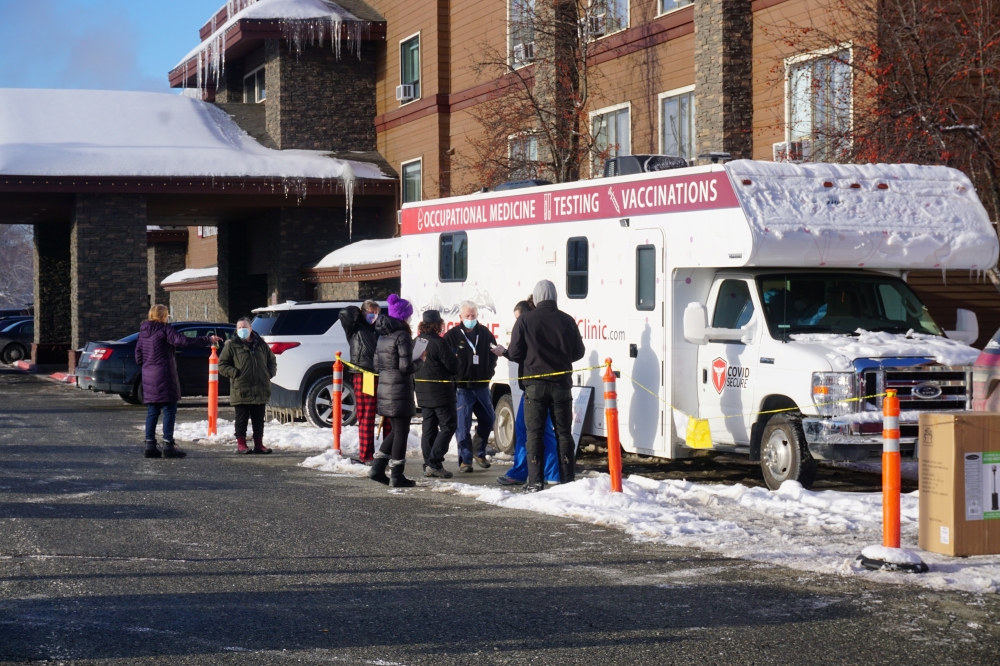 Support workers for the Iditarod Trail Sled Dog Race line up outside the Lakefront Anchorage Hotel, the site of the temporary Anchorage Iditarod headquarters, to be tested for coronavirus (COVID-19), in Anchorage, Alaska, U.S., March 4, 2021. The workers 
