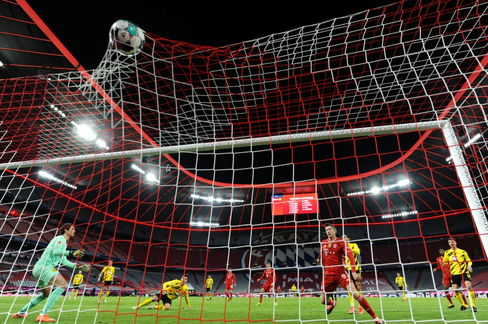 Bayern Munich's Robert Lewandowski scores their first goal Pool via REUTERS/Andreas Gebert 