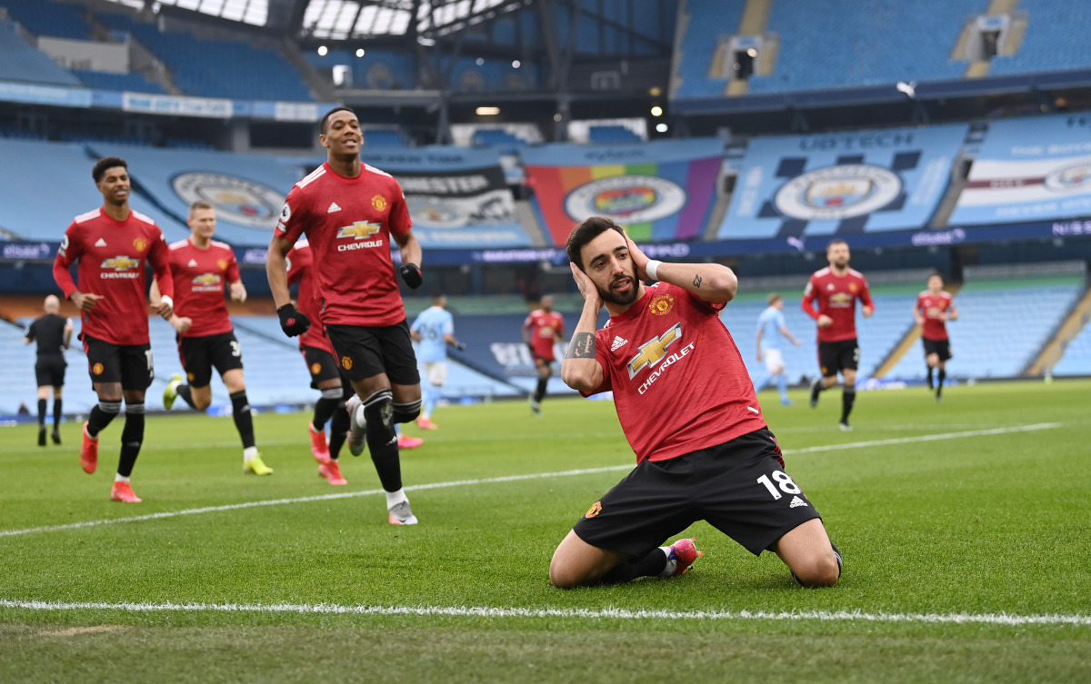 Soccer Football - Premier League - Manchester City v Manchester United - Etihad Stadium, Manchester, Britain - March 7, 2021 Manchester United's Bruno Fernandes celebrates scoring their first goal Pool via REUTERS/Laurence Griffiths