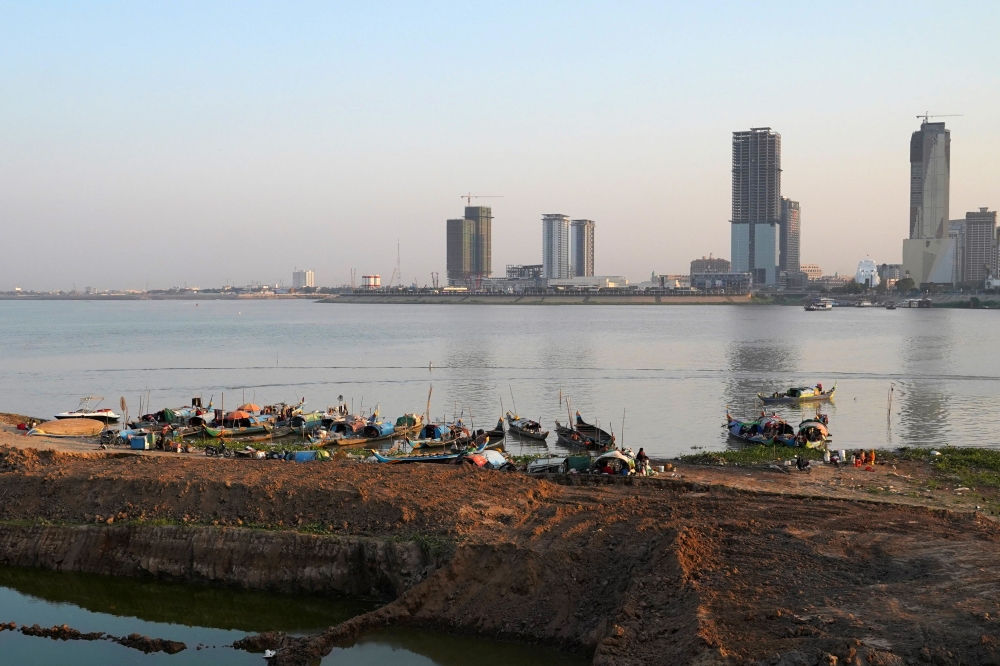 A group of fishermen boats are seen on the Mekong river in Phnom Penh, Cambodia, February 19, 2021. Picture taken February 19, 2021. REUTERS/Cindy Liu