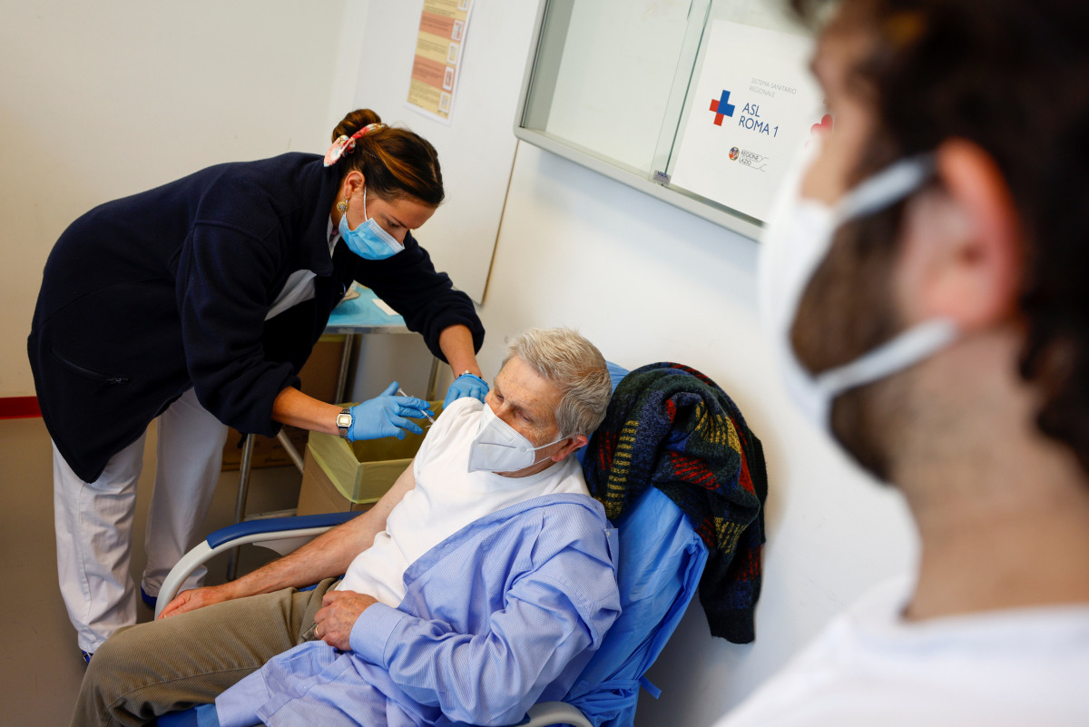 A man receives a dose of the Pfizer-BioNTech vaccine during the coronavirus disease (COVID-19) vaccination campaign, as the country sees a surge in the number of infections, in Rome, Italy, March 4, 2021. REUTERS/Guglielmo Mangiapane
