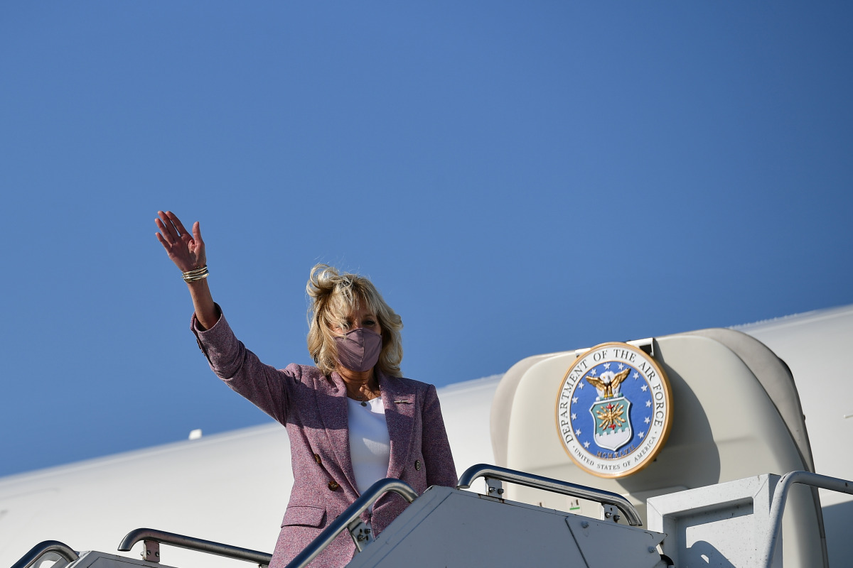 U.S. first lady Jill Biden waves upon arriving at Erie International Airport, Pennsylvania, U.S., March 3, 2021. Mandel Ngan/Pool via REUTERS
