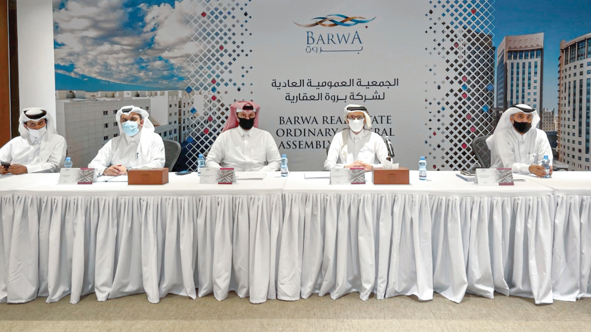 Salah bin Ghanem Al Ali, Chairman of Board of Directors, and other officials during Ordinary General Assembly Meeting of Barwa Real Estate Company held yesterday.