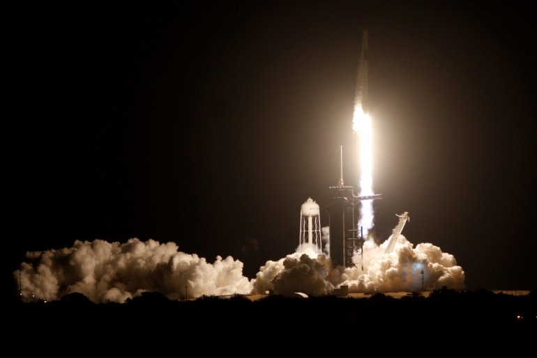 A SpaceX Falcon 9 rocket, with the Crew Dragon capsule, is launched carrying four astronauts on the first operational NASA commercial crew mission at Kennedy Space Center in Cape Canaveral, Florida, U.S. November 15, 2020. REUTERS/Thom Baur
