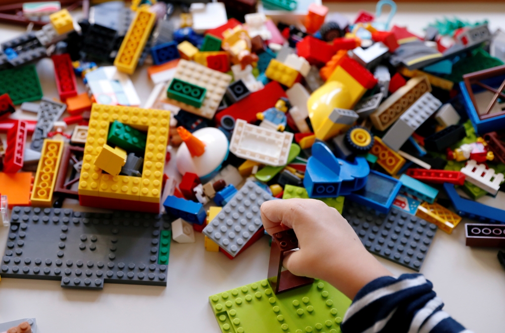 File photo: Sirio Persichetti, a 7-year-old Italian with spastic tetraplegia and cerebral palsy who has become an influencer by challenging perceptions of disability, builds a house out of lego, in Rome, Italy, October 20, 2020. Reuters/Yara Nardi/File Ph