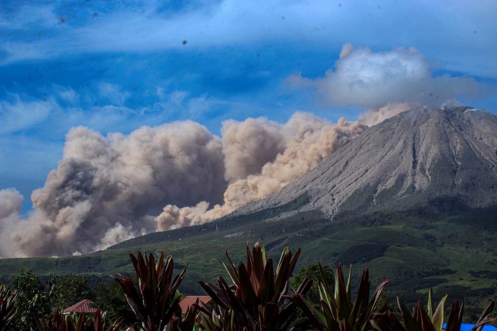 Mount Sinabung volcano erupts as seen from Kuta Rakyat village in Karo, North Sumatra Province, Indonesia March 11, 2021, in this photo taken by Antara Foto/Sastrawan Ginting/via Reuters