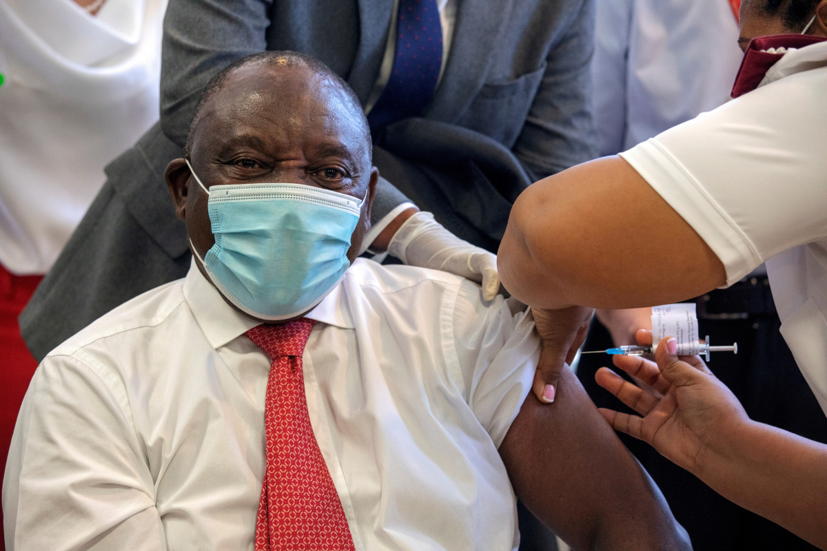 FILE PHOTO: South African President Cyril Ramaphosa receives the Johnson and Johnson coronavirus disease (COVID-19) vaccination at the Khayelitsha Hospital near CAPE TOWN, South Africa, February 17, 2021. Gianluigi Guercia/Pool via REUTERS//File Photo
