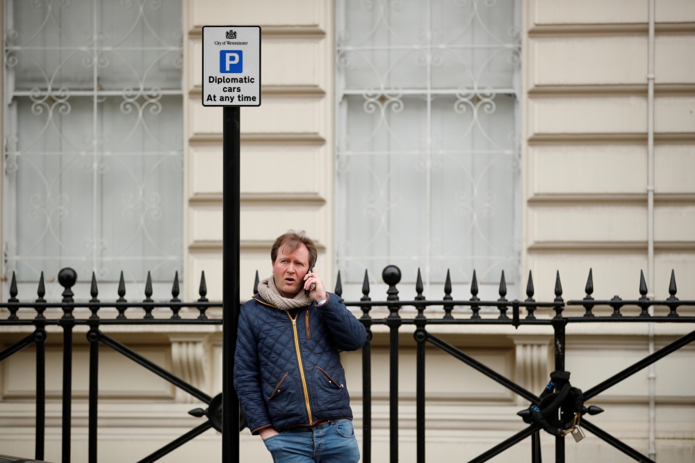 Richard Ratcliffe, husband of British-Iranian aid worker Nazanin Zaghari-Ratcliffe, talks on a mobile phone outside the Iranian Embassy in London, Britain March 8, 2021. REUTERS/Andrew Boyers