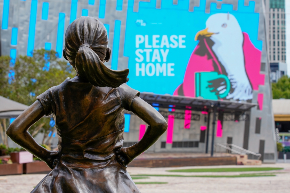 The Fearless Girl Statue looks at a 