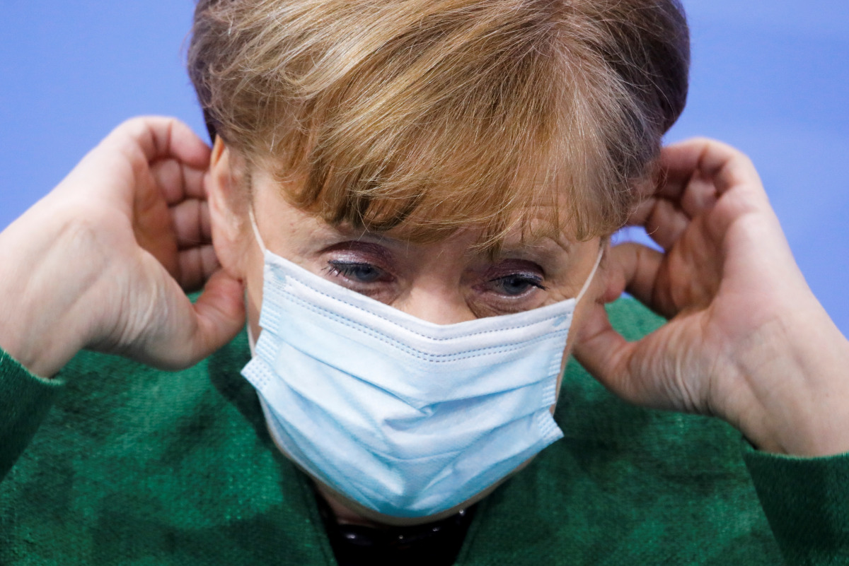 German Chancellor Angela merkel adjusts her face mask after a news conference following the 13. Integration Summit at the chancellery in Berlin, Germany March 9, 2021. Markus Schreiber/Pool via REUTERS
