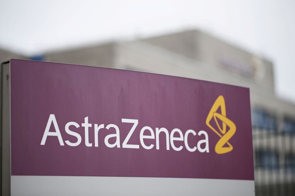 FILE PHOTO: The logo of the German branch of British-Swedish pharmaceutical company AstraZeneca is pictured in Wedel near Hamburg, Germany, March 1, 2021. REUTERS/Cathrin Mueller/File Photo
