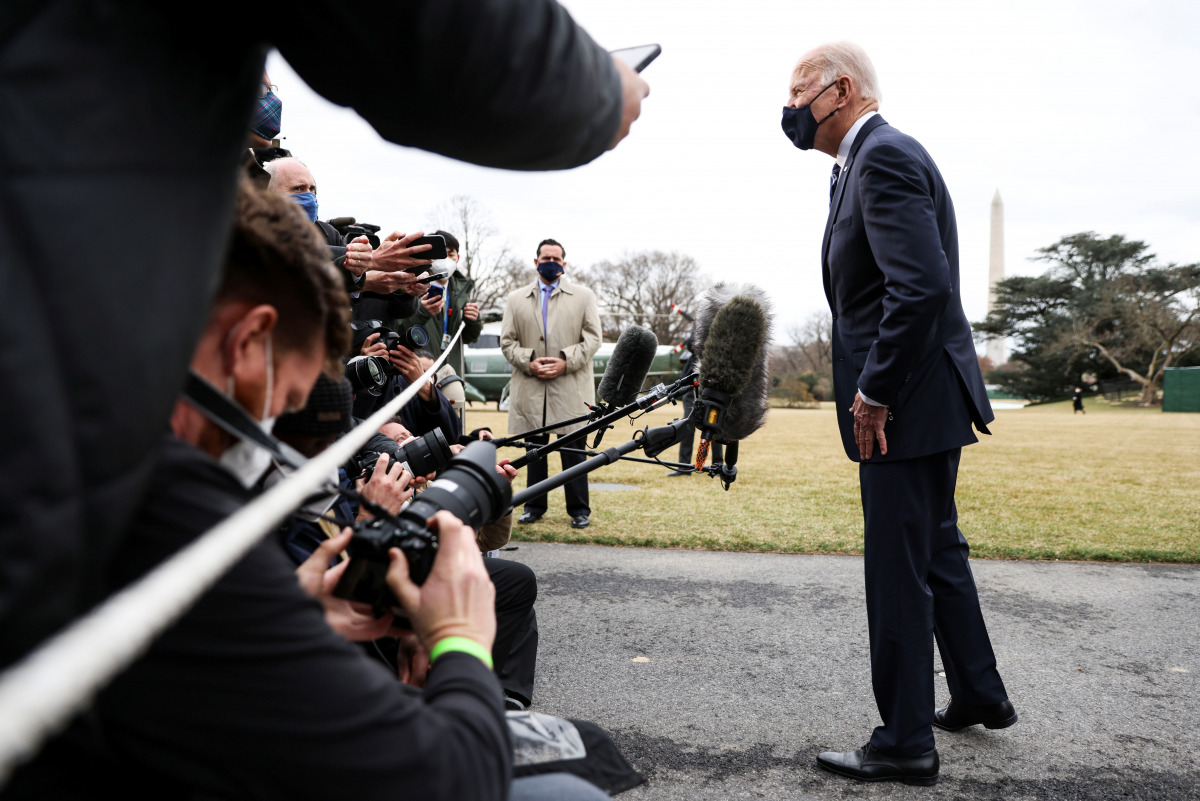 U.S. President Joe Biden talks to reporters as he departs for travel to Pennsylvania to promote the 