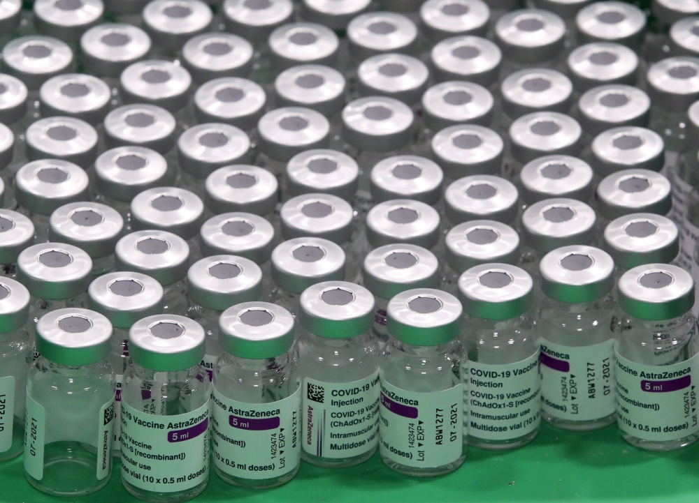 Empty vials of Oxford/AstraZeneca's COVID-19 vaccine are seen at a vaccination centre in Antwerp, Belgium March 18, 2021. REUTERS/Yves Herman/File Photo