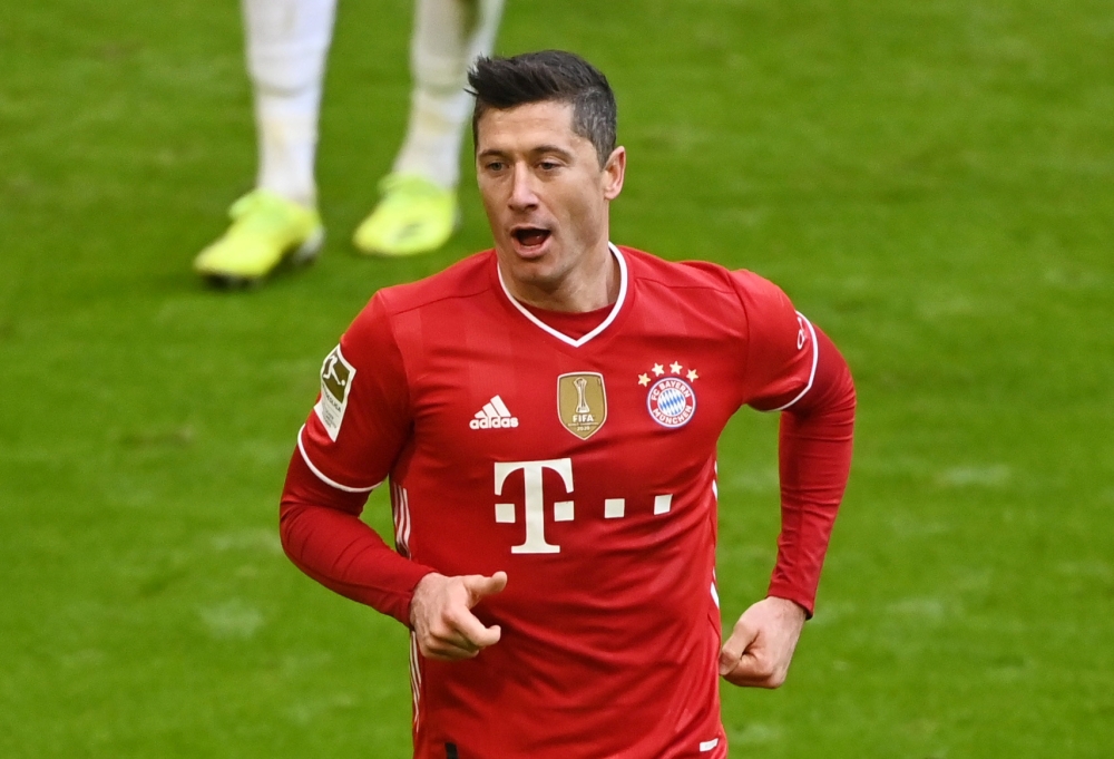 March 20, 2021 Bayern Munich's Robert Lewandowski celebrates scoring their fourth goal and completing his hat-trick Pool via REUTERS/Matthias Balk