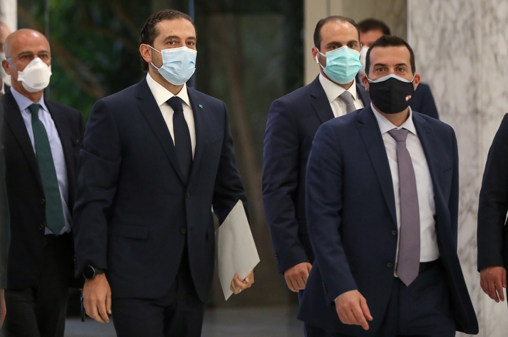 Prime Minister-designate Saad al-Hariri arrives to meet with Lebanon's President Michel Aoun at the presidential palace in Baabda, Lebanon March 22, 2021. REUTERS/Mohamed Azakir