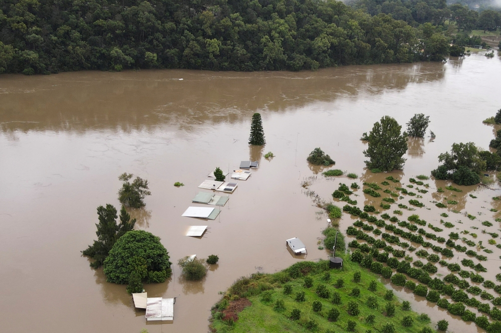 A view of orange orchards and houses that are submerged, as the state of New South Wales experiences widespread flooding and severe weather, near Hawkesbury River in northwestern Sydney, Australia, March 23, 2021. Picture taken with a drone. REUTERS/Jill 