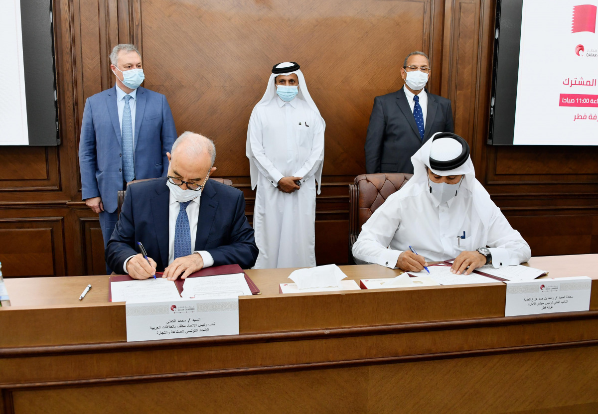 Officials of Qatar Chamber and Tunisian Union of Industry and Commerce during the signing of the agreement.