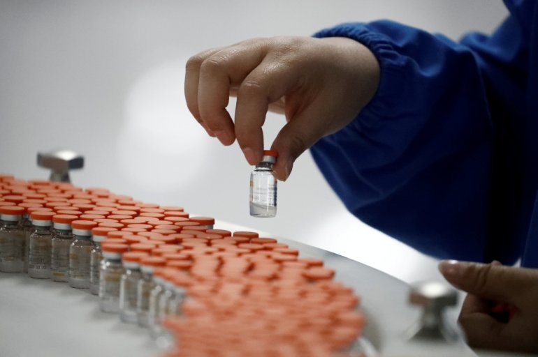 A worker performs a quality check in the packaging facility of Chinese vaccine maker Sinovac Biotech, developing an experimental coronavirus disease (COVID-19) vaccine, during a government-organized media tour in Beijing, China, September 24, 2020. REUTER