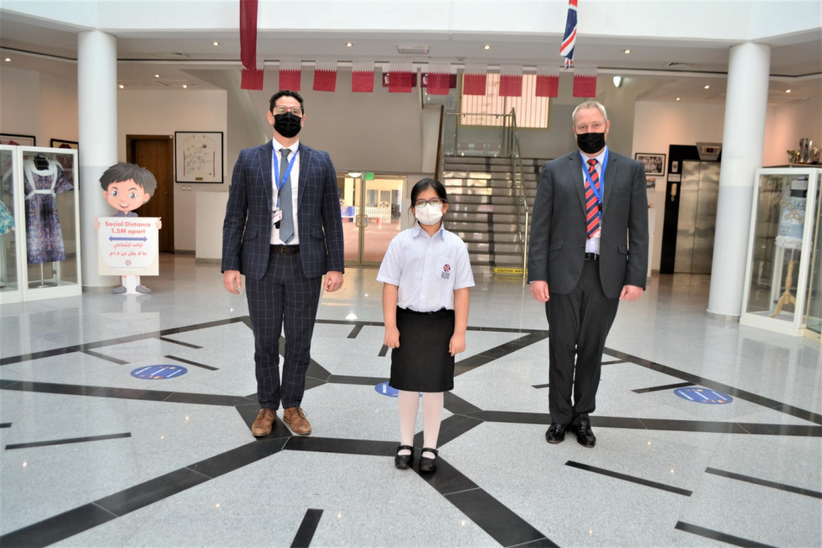 Saniya Saqib flanked by DBS Headteacher and Principal