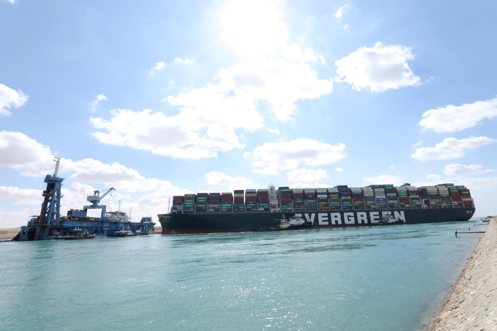 FILE PHOTO: Stranded container ship Ever Given, one of the world's largest container ships, after it ran aground, March 26. SCA/via REUTERS/File Photo
