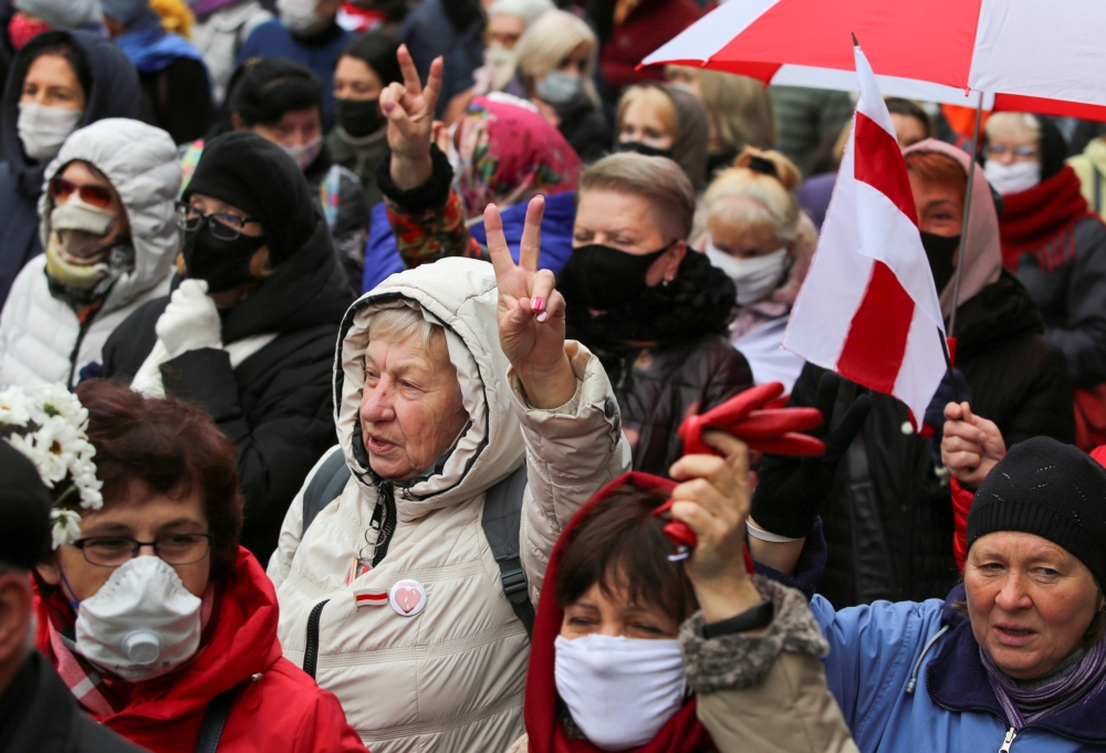 FILE PHOTO: Belarusian opposition supporters attend a rally to protest against the results of a presidential election and urge President Alexander Lukashenko to step down in Minsk, Belarus November 2, 2020. REUTERS