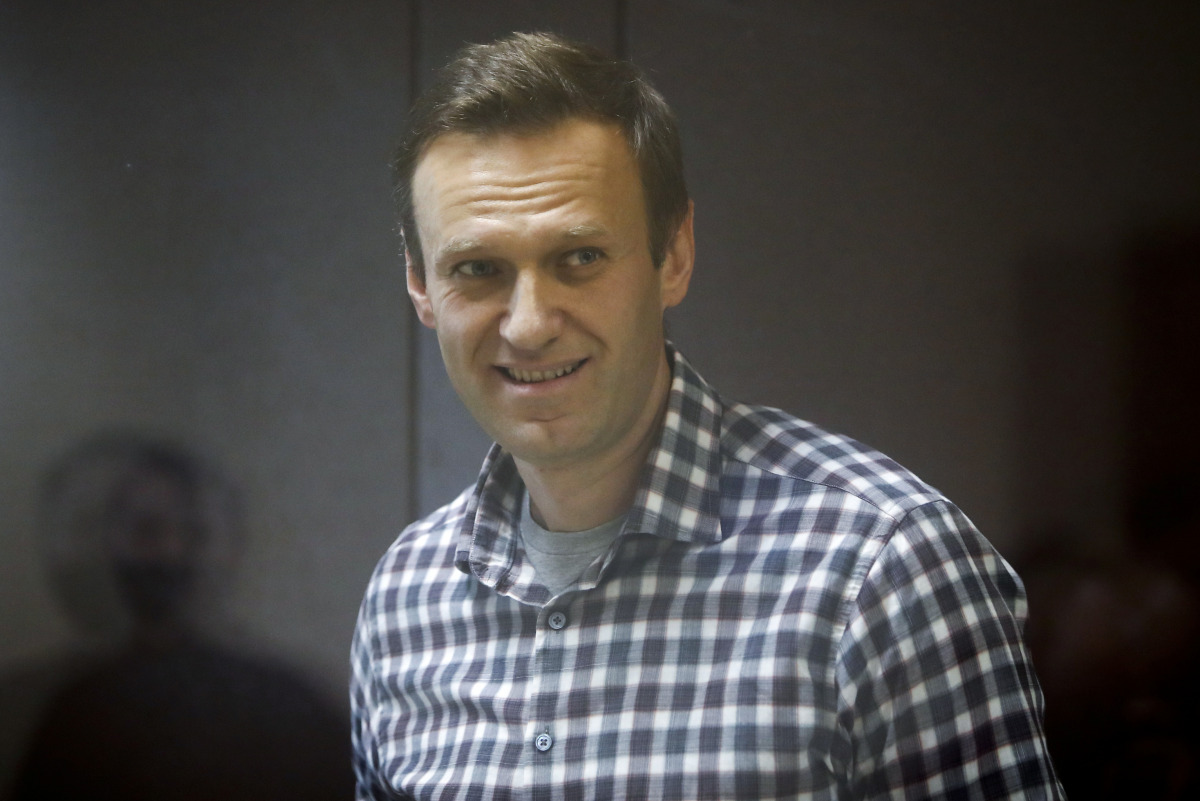 FILE PHOTO: Russian opposition leader Alexei Navalny attends a hearing to consider an appeal against an earlier court decision to change his suspended sentence to a real prison term, in Moscow, Russia February 20, 2021. REUTERS/Maxim Shemetov/File Photo

