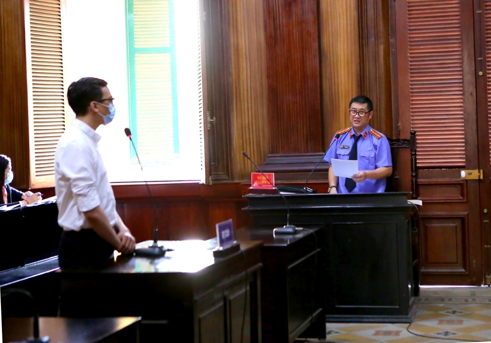 Vietnam Airlines flight attendant Duong Tan Hau, attends court before being found guilty of violating COVID-19 quarantine rules and handed a two year suspended prison term in Ho Chi Minh City, Vietnam March 30, 2021. VNA via REUTERS