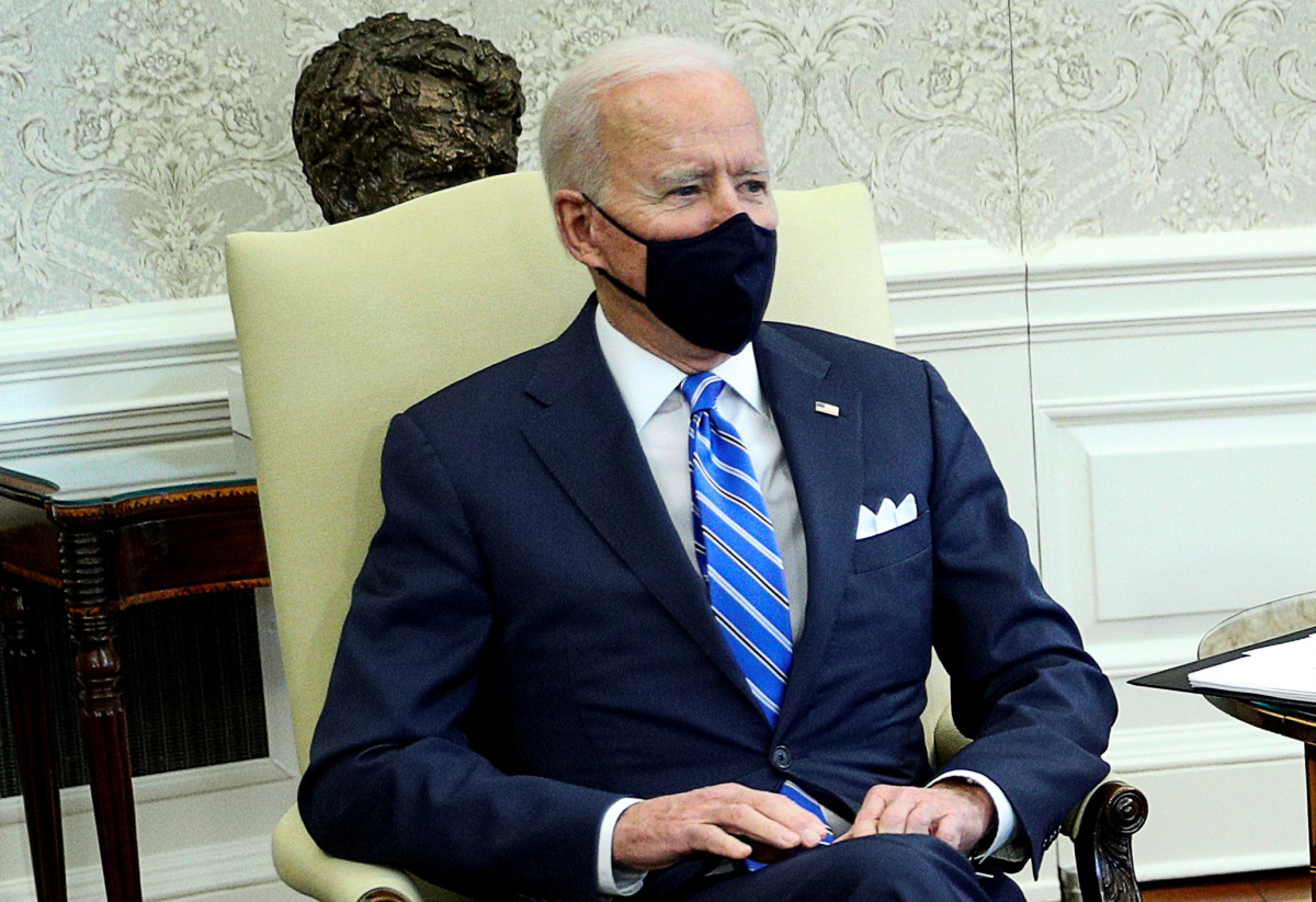 FILE PHOTO: U.S. President Joe Biden holds a meeting on Infrastructure with members of Congress in the Oval Office at the White House in Washington, U.S., March 4, 2021. REUTERS/Tom Brenner/File Photo
