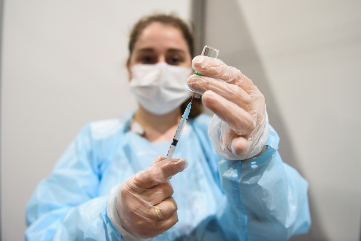 A medical worker fills a syringe with a dose of AstraZeneca's coronavirus disease (COVID-19) vaccine at the Belexpo vaccination centre, as Serbia started to immunise business people across the region, in Belgrade, Serbia, March 27, 2021. REUTERS/Zorana Je