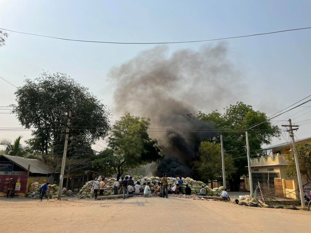 Protesters gather behind a barricade during a protest against the military coup, in Monywa, Myanmar April 3, 2021 in this photo obtained by Reuters. 